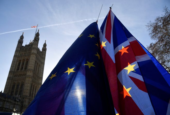 Demonstrators hold EU and Union flags during an anti-Brexit protest opposite the Houses of Parliament in London, Britain, December 17, 2018. REUTERS/Toby Melville