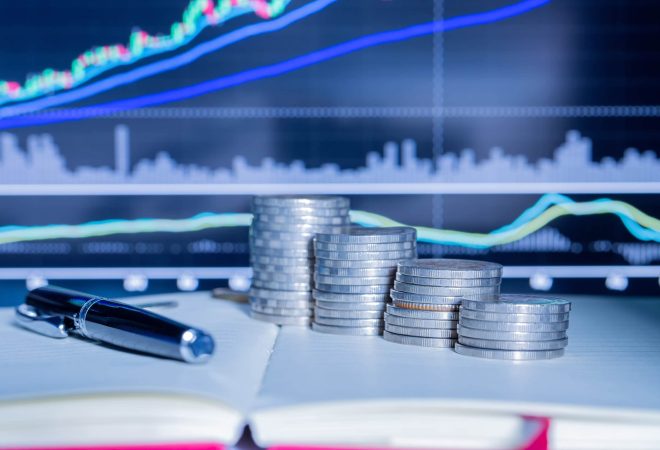 Stack of money coin with trading graph. financial investment concept use for background.