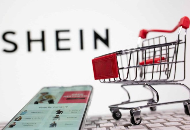 FILE PHOTO: A keyboard and a shopping cart are seen in front of a displayed Shein logo in this illustration picture taken October 13, 2020. REUTERS/Dado Ruvic/Illustration/File Photo