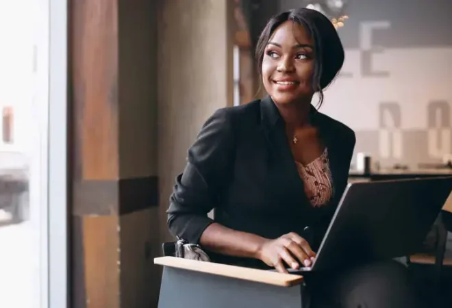african-american-business-woman-working-on-a-computer-in-a-bar-scaled-1_p38463_cover_image_resized