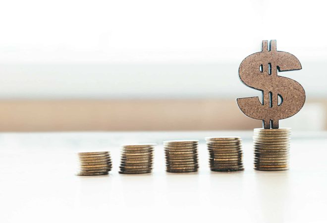 Banking and saving money copyspace background idea concept. Coin stacks and dollar sign.