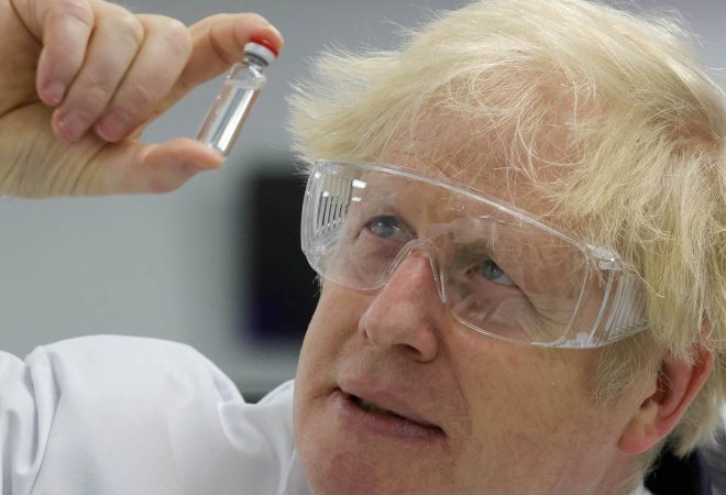 30/11/2020. London, United Kingdom. Boris Johnson visits Wockhardt. The Prime Minister Boris Johnson holds up the Oxford/AstraZeneca Covid vaccine on a visit to  the global pharmaceutical and biotech company Wockhardt in Wrexham, Picture by Andrew Parsons / No 10 Downing Street