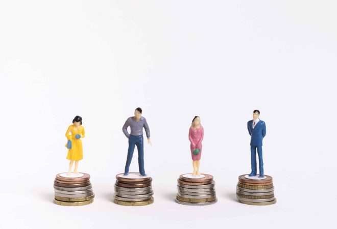 business-man-woman-sitting-equal-piles-coins