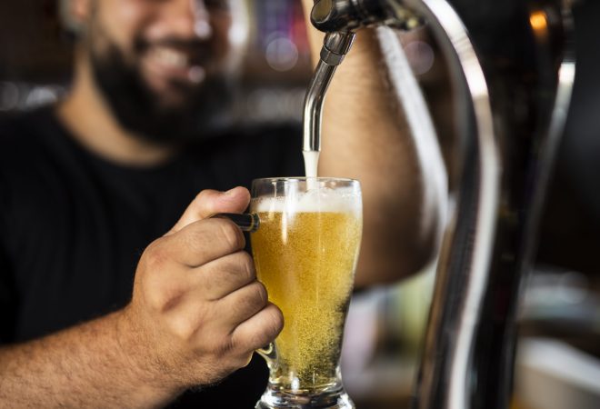 close-up-bartender-creating-delicious-drink