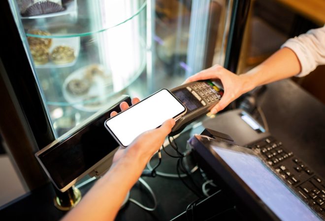 close-up-hands-holding-pos-machine