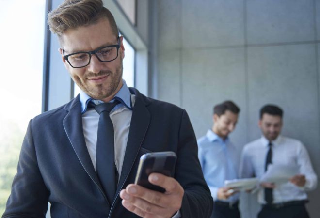Owner of the company using his phone