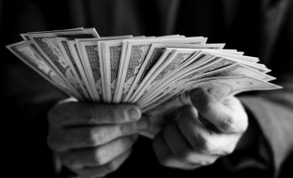 Closeup of hands holding cash