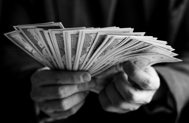 Closeup of hands holding cash