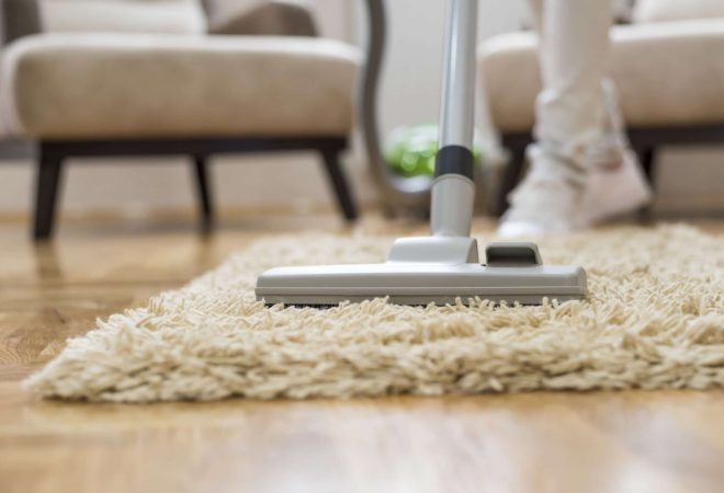 A closeup of a vacuum cleaner at a living room