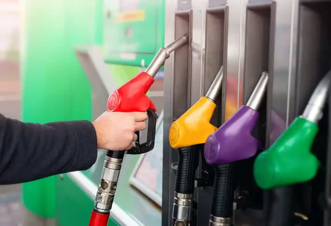 closeup-of-male-hand-holding-gas-red-pump-nozzle-2022-01-05-21-47-09-utc