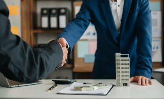 Customers who choose to buy a condominium room and a bank approve a loan for their purchase. Condominium and house loan interest rate from bank concept in office