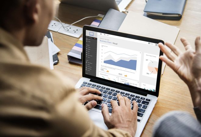 People working on a laptop in a meeting