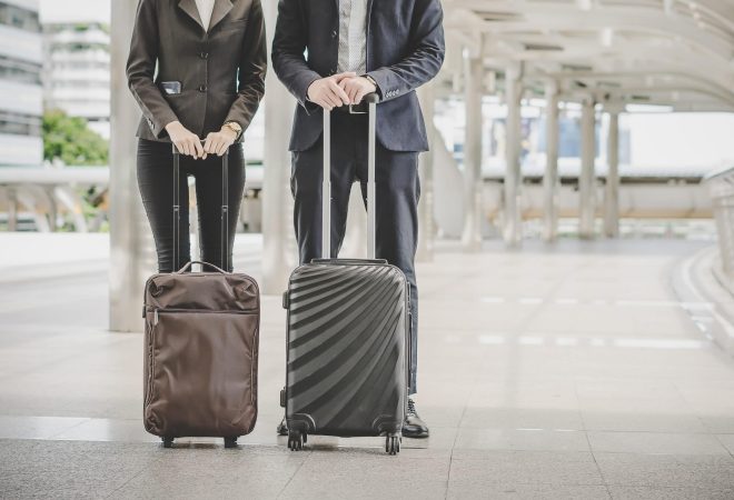 Business man and woman are going on business trip.