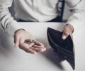 businessman saving money, Close up man carrying a wallet in hand, the dollar,finance accounting concept