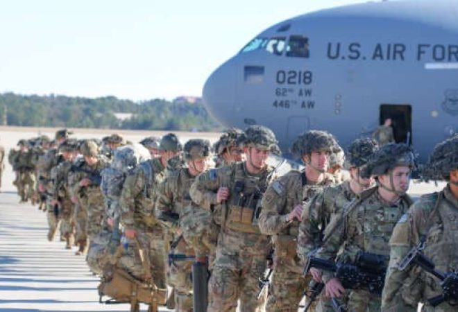 U.S. Army Paratroopers assigned to the 2nd Battalion, 504th Parachute Infantry Regiment, 1st Brigade Combat Team, 82nd Airborne Division, deploy from Pope Army Airfield, North Carolina, Jan. 1, 2020. Elements of the Immediate Response Force mobilized for deployment to the U.S. Central Command area of operations in response to increased threat levels against U.S. personnel and facilities. The IRF and the All American Division remain postured and ready to deploy in support of the National Command Authority. (U.S. Army photo by Capt. Robyn J. Haake)