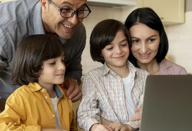 family-looking-together-laptop-home_900