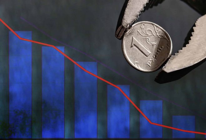 Wrench holds in vise bent metal coin with a face value of 1 Russian ruble. Collapse of the ruble and the economy, sanctions against Russia, the economic crisis in Russia. Copy space, selective focus