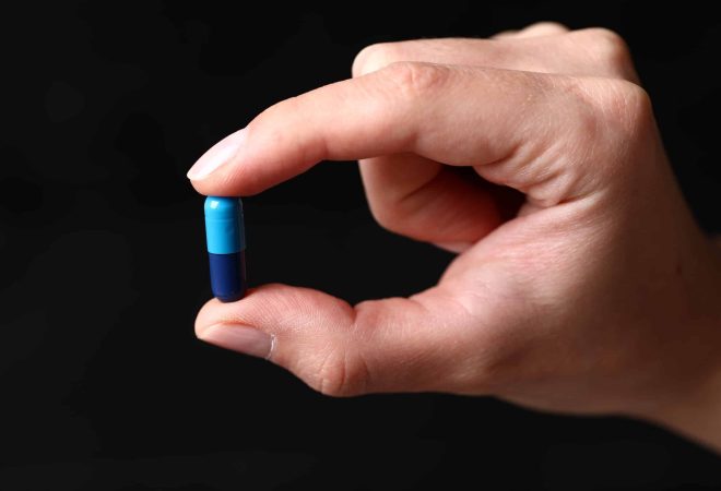 freepik_blue-medical-pill-hand
