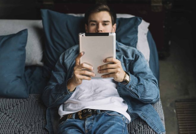 freepik_man-looking-digital-tablet