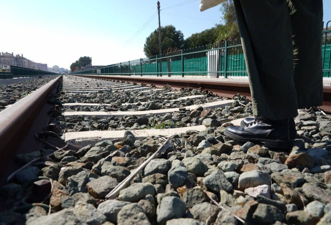 The rusted rails in the railway station during daytime