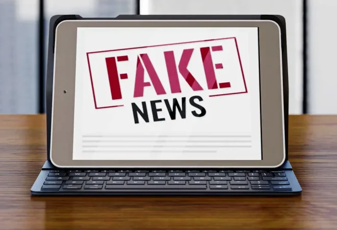 front-view-laptop-desk-with-fake-news_0