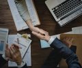 Business people shaking hands together