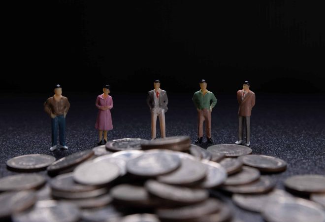 Miniature people: Group of small businessmen standing on coin with  Business Growth concept.