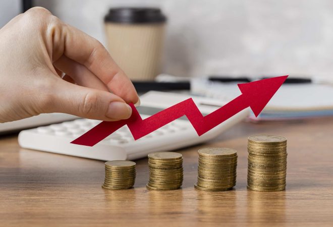 hand-holding-growth-arrow-with-coins-scaled