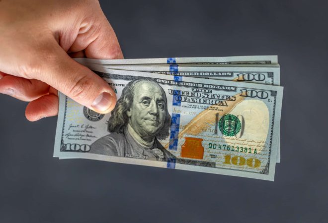 Hand holding money. International currency. Exchange world money. Investment concept. First person top view photo of hand holding fan of money dollars over on isolated dark background. SSUCv3H4sIAAAAAAAAA41Py46DMAz8F5+DZB6lkF+pegjEUKuUVInTaoXy76tQqr3ubcb2PLwBW9DQY4WEHRZjc2qLsqSp6Grsi7Y/mb4ZajtMEyiwRgh0WdcdttX5XPZlUyEiKhhM4BH0BrwsMYg3wm4FjQo8rZb8DsmyOM9mAY1JQRAjMVAAvSUFoxGaneedf/0uW56DBlAQ4pBBUv+cXRWYmdbxJ/unXGQhs8ddrgrubyH/OLKd3HLFDJ+eR17no1MM4h4fvDrJ2j1B3Hhne4g/b9w4iPM5C+JzccaSPdZxeLDIl3p6Mb3/rlNKvzXDDXiEAQAA