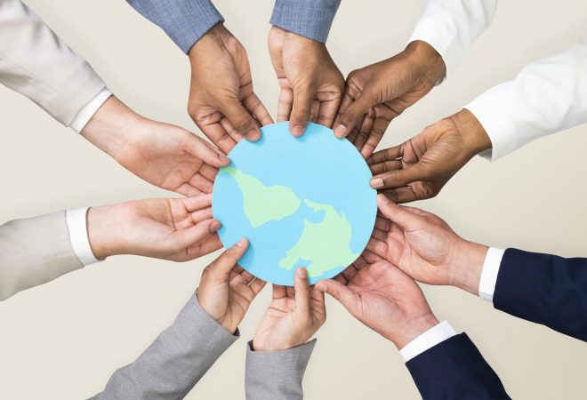 Hands holding earth CSR business campaign