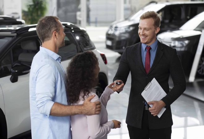happy-couple-car-showroom-dealership