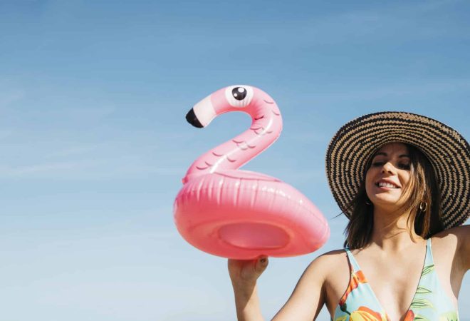 happy-girl-with-inflatable-flamingo
