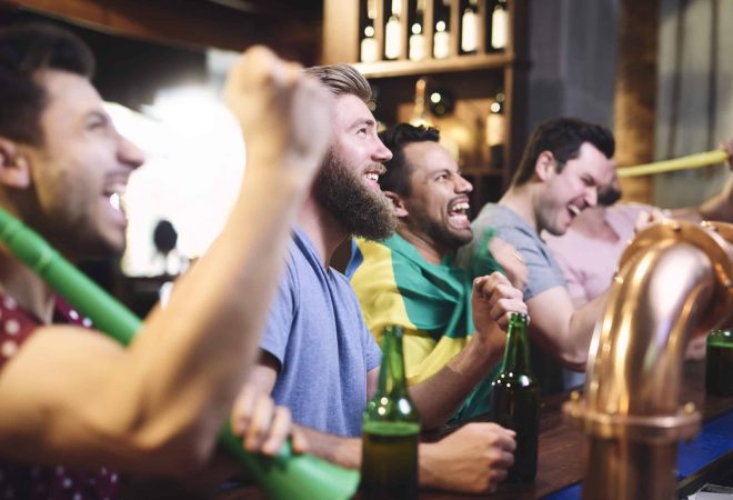 Happy men while watching american football
