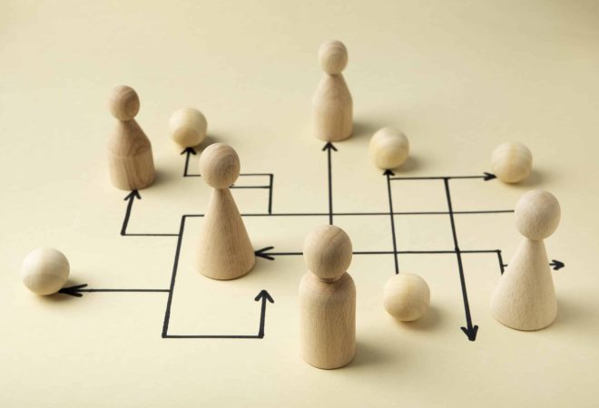 high-angle-wooden-pawns-arrangement_freepik