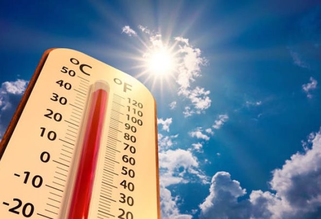 climate change, low angle view Thermometer on blue sky with sun shining in summer show increase temperature, concept global warming