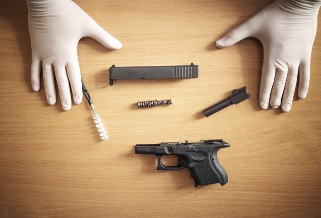 Firearm cleaning and maintenance after use at shooting range.