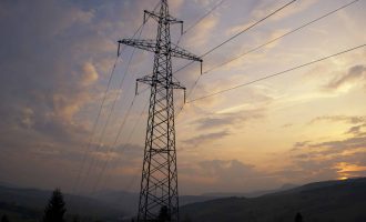 Sunset in Carpatian mountains in summer and electrified track