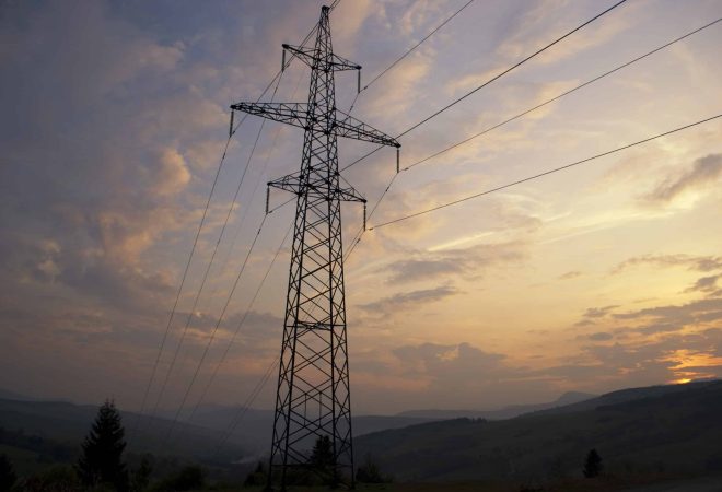Sunset in Carpatian mountains in summer and electrified track
