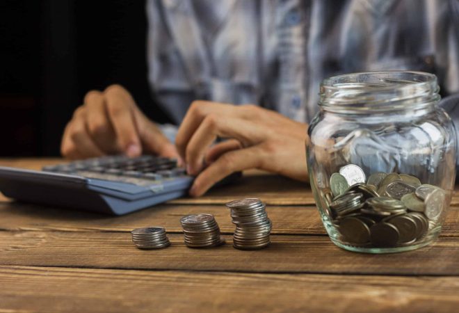 man-calculating-monthly-savings