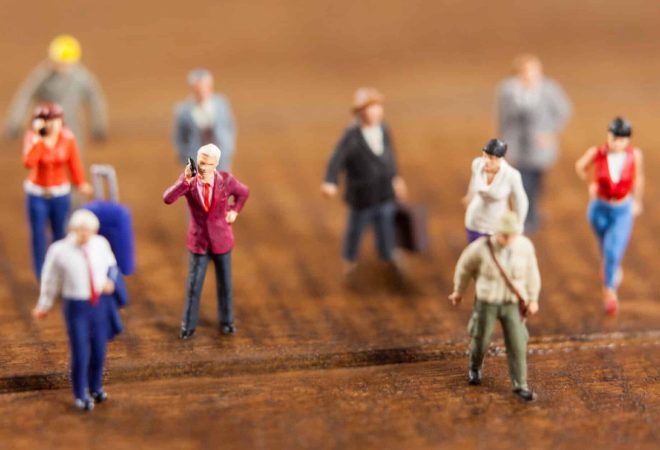 Conceptual image of miniature people travelling