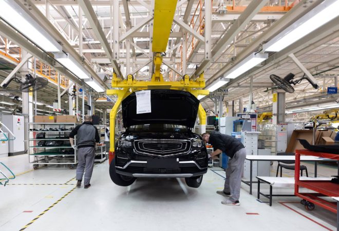 Minsk, Belarus - Dec 15, 2021: Automobile production line. Welding car body. Modern car assembly plant. Auto industry. Interior of a high-tech factory, modern production.