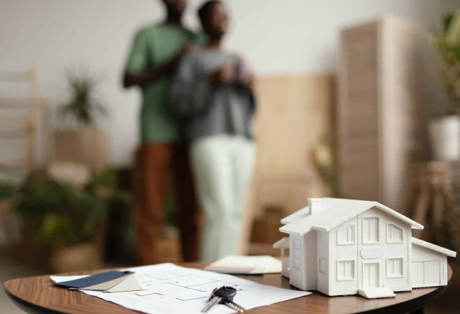 new-home-keys-plan-table-with-defocused-couple