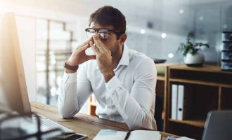 Office, stress and business man on computer for deadline on web design, project and research. Corporate, company and exhausted, fatigue and overworked person on pc for website, email and burnout.