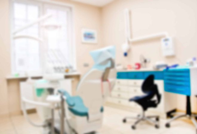 Professional Dentist tools in the dental office. Dental Hygiene and Health conceptual image. Blurred image.