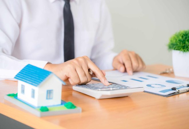 Real estate broker agent presenting and consult to customer to decision making sign insurance form agreement, home model, concerning mortgage loan offer for and house insurance.
