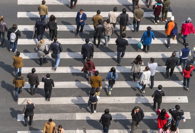 Aerial view of people on busy pedestrian crossing, Shanghai, China