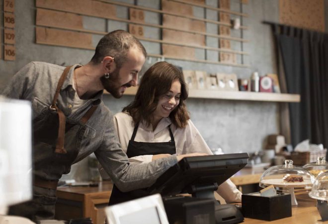 smiling-man-woman-cash-register (1)