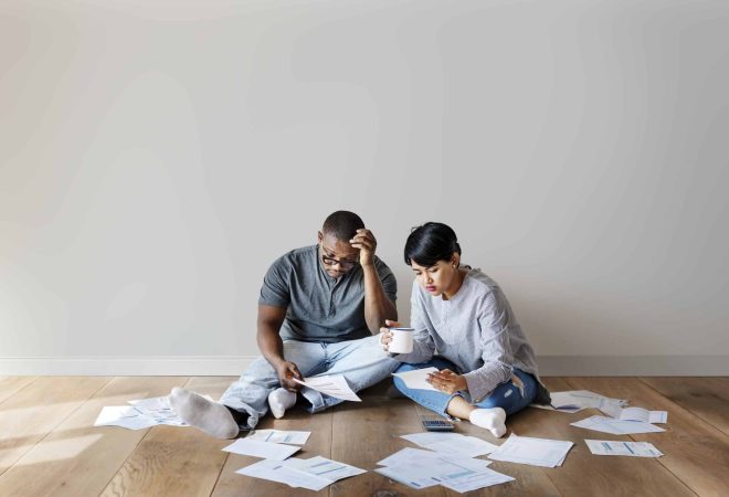Stressed couple figuring out their finances