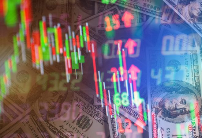 Double exposure of stock market in tablet with money and chart.