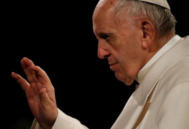 Pope Francis waves to the faithful after the Via Crucis (Way of the Cross) procession during Good Friday celebrations at the Colosseum in Rome